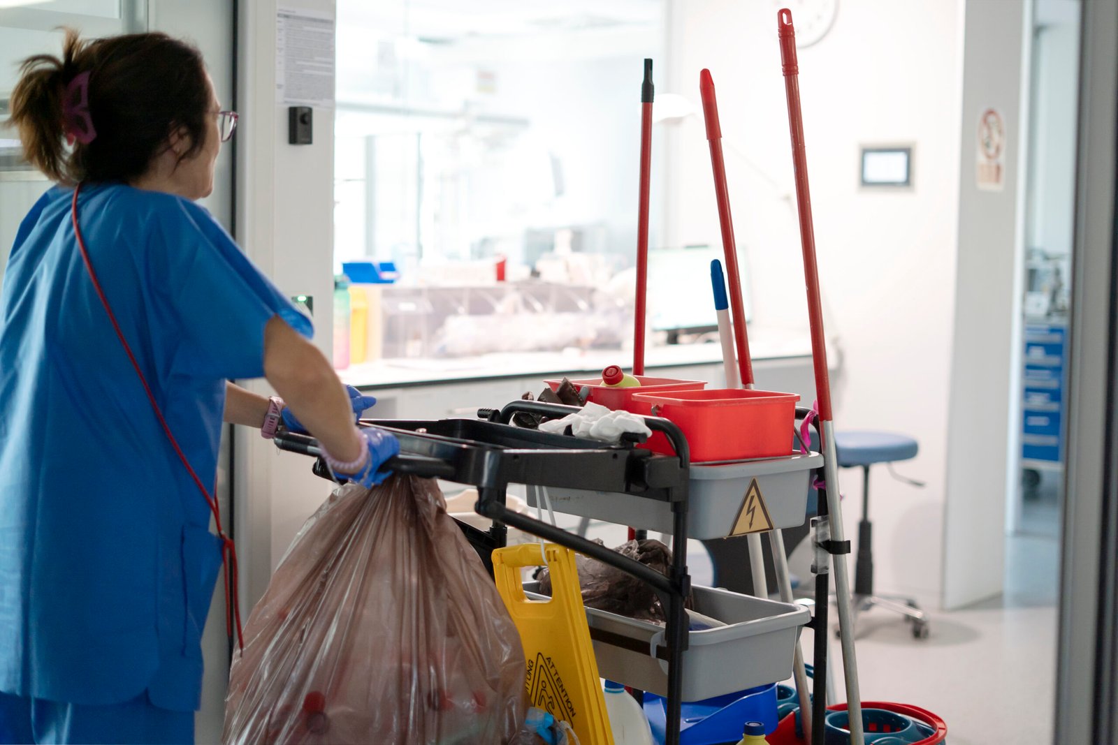 janitor pushing a cleaning cart in hospital corrid 2026 03 27 00 44 52 utc 1 scaled