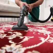 Dry,Cleaner's,Employee,Hoovering,Carpet,With,Vacuum,Cleaner,Indoors,,Selective